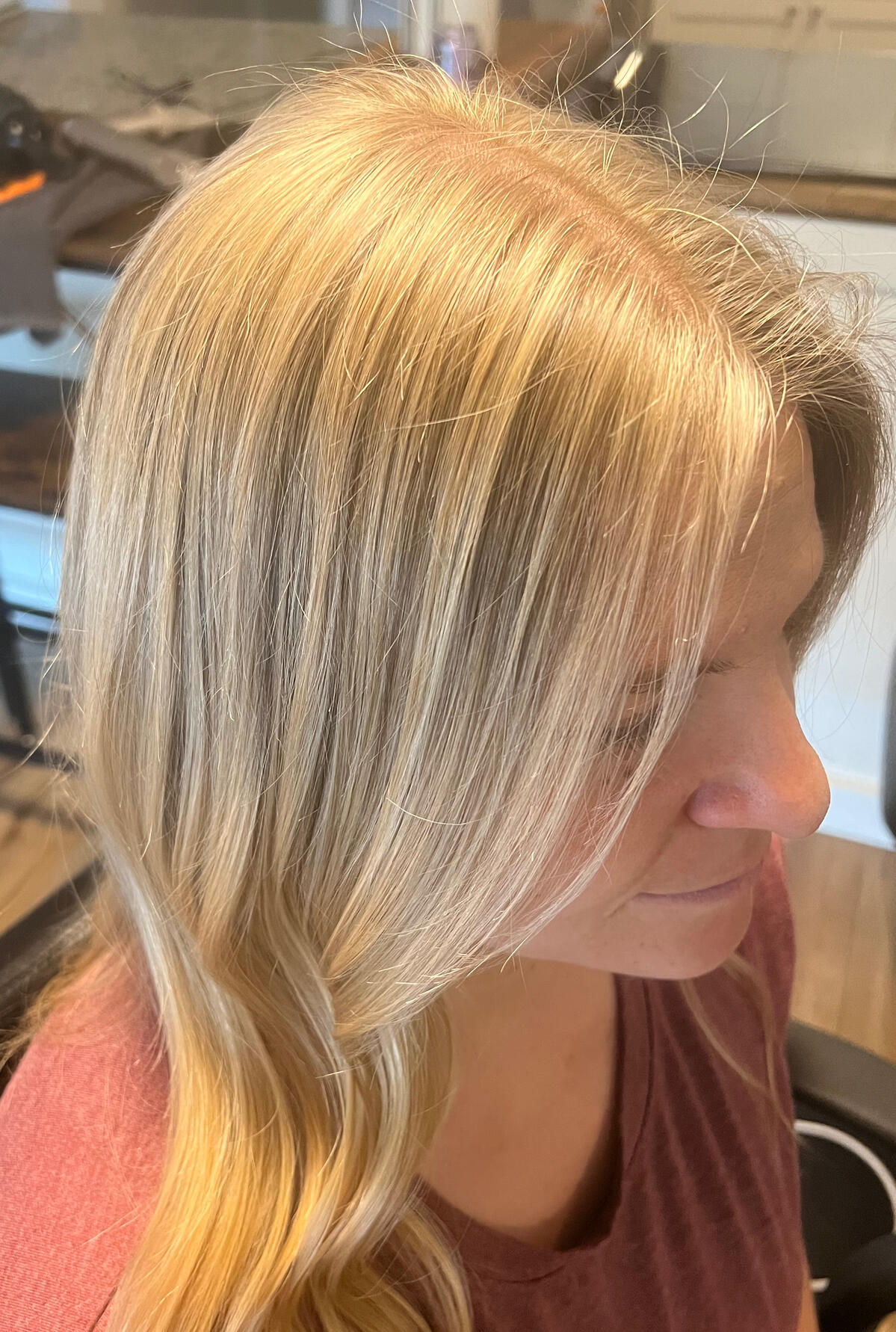 Blonde highlights and a smooth, face-framing hairstyle